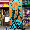 La Demoiselle Barbouquin dans une fresque murale street art de la rue Denoyez à Paris